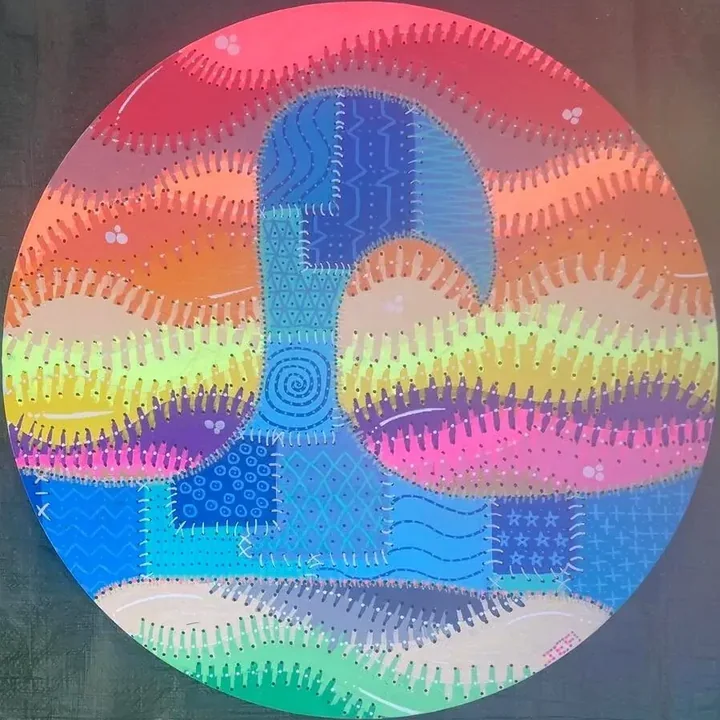 Round hand-painted artwork of a wave in rainbow colours